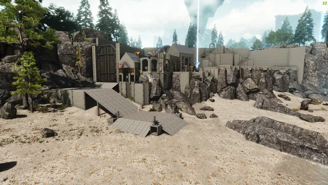 A fortified stone base on a beach under a beam of light