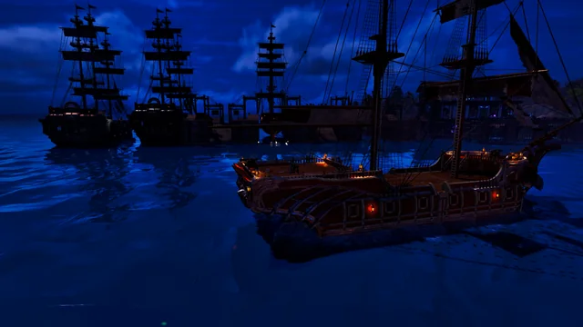 Sailing ships moored at night